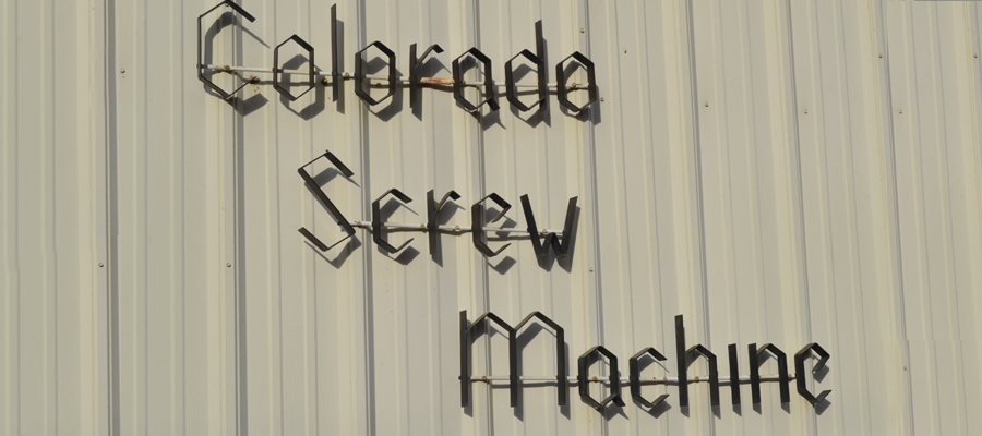 Colorado Screw Machine lettering mounted on the exterior of the Loveland shop